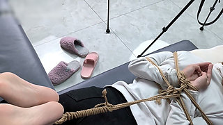 The Extreme Restraints of a Barefoot Girl, Playing with Her Bare Feet
