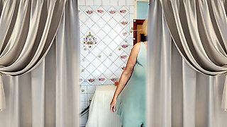 Hot housewife Lukerya with disheveled hair drinks tea and twerks in the kitchen.