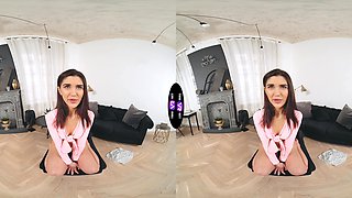 A long-haired brunette plays with her natural tits