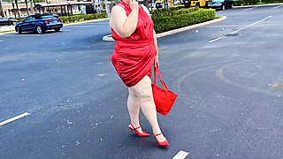 Beautiful Woman Walking Outdoors in  Parking Lot Showing off for Strangers