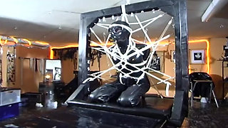 Extreme bondage for latex fetish slut