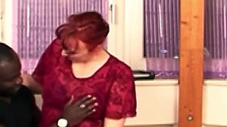 Redhead old boss is fucked by black help with a big cock in the office