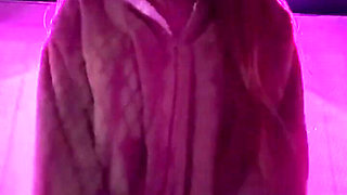 Smoking a Cigarette Outdoor While Wearing Only a Bikini and a Jacket