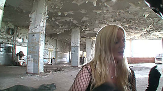 Two Latex Dommes Destroy Masked Slave in Abandoned Warehouse