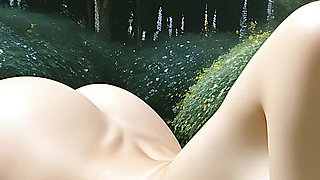 Beautiful Nude Girl Relaxing in the Garden