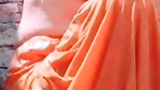 While Bathing, the Village Woman Is Taking a Bath Naked After Taking off Her Clothes Completely
