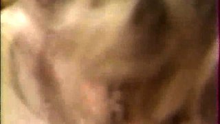 Two blonde mature lesbians licking and fingering on couch