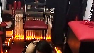 Dominatrix Locks Submissive's Throbbing Cock in Chastity Cage