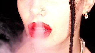 4K Applying crimson lip liner and smoking hookah on black background