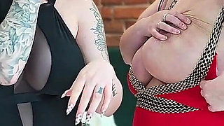 Two College Girls with Big Breasts Smoke Cigarettes and Fuck Each Other with a Double Dildo.