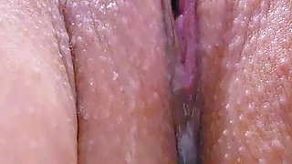 Close up with blonde seductress masturbating pussy