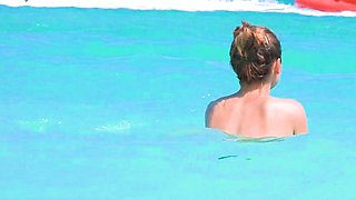 Smoothest nudist play in the warm water  at a nudist beach