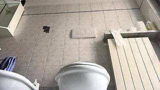 Sexy mistress shows her foot in close up in the bathroom