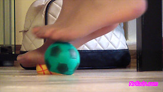 Nyllady Squeezes Rubber Balls Massaging Her Hosed Feet