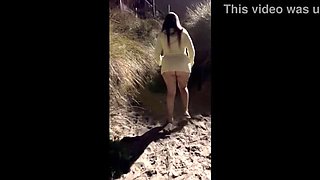 Public beach tryst in minidress