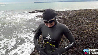Rubbery Beach Encounter: Lucy's Neoprene Pussy Play with Stranger