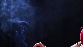 Sexy Lady in Red Is Smoking Two 100mm Reds