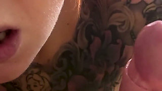 Tattooed Redhead Footjob Fun