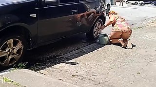 HOT GIRL WASHES HER CAR SHOWING OFF ON THE STREET