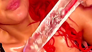 A Thick Redhead Deep Throats & Fucks a Giant Dildo