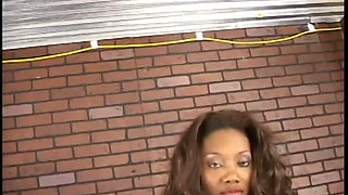 Sexy ebony dominatrix whips male slave before using vibrator on him
