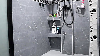 A Thai Woman Is Taking a Shower, Revealing Her Pink Nipples and Smooth, Soft Vagina While Applying Body Lotion