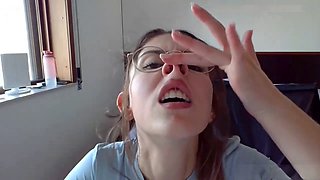 Smiley brunette teen in glasses showing off her petite body solo