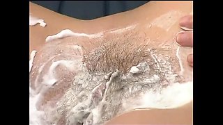 Naughty lesbian shaves her cunt then fingers it