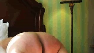 Lashing slut Mary's fat old ass with the belt