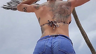 Giant Muscular Goddess on the Beach