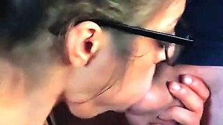 Oral slut sucks and lets him rub his cock in her face while playing PS