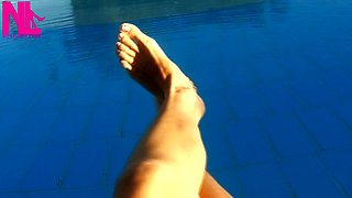 Barefoot Dangling in Swimming Pool Water