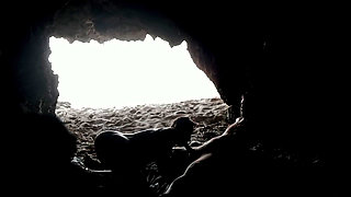 Couple recorded at the beach, inside the cave
