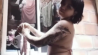 Colombian Dances While Her Neighbor Watches Her